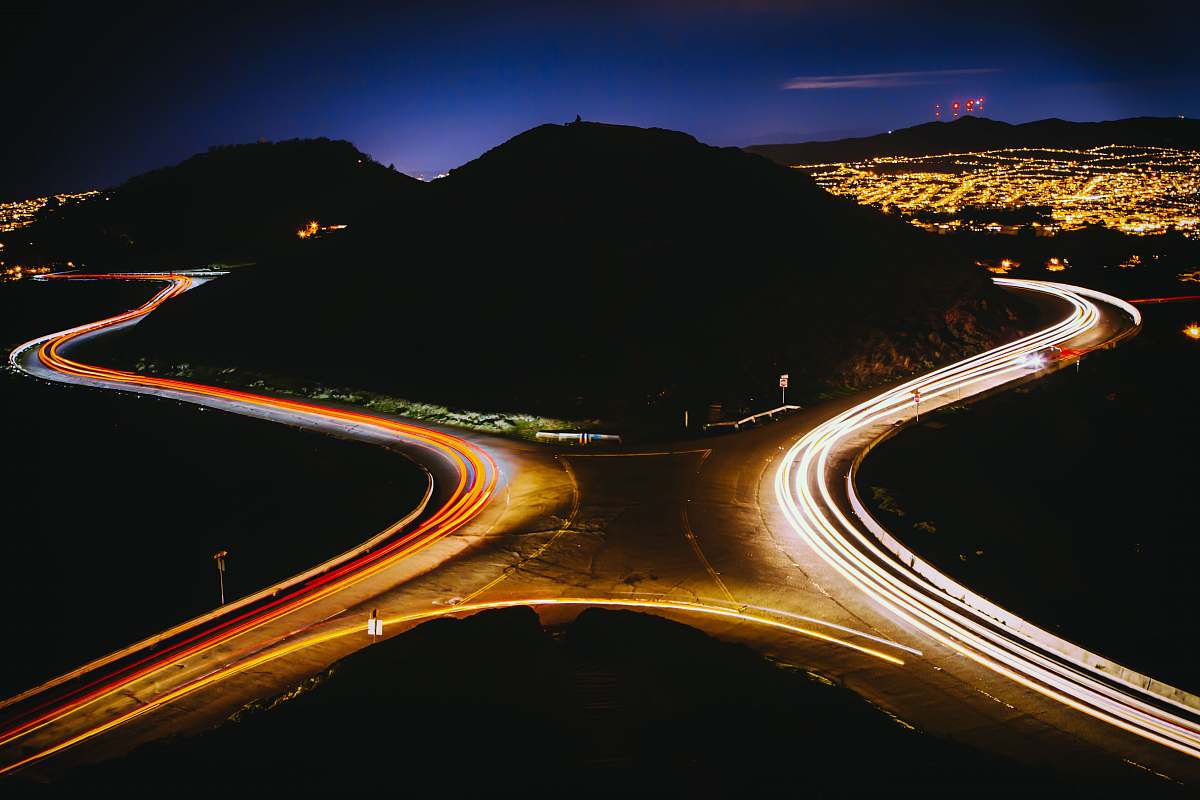 san francisco aerial view photography of cross road near mountain during nighttime city
